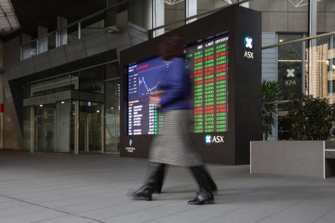 Australian shares hit record high but close lower