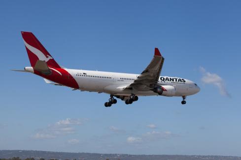 Qantas releases the loyalty parachute as profits fall