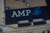AMP posts loss, dragged down by outflows